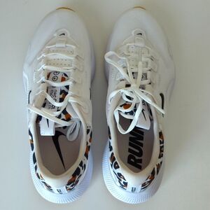 White Nike tennis shoe size 5 with leopard accent